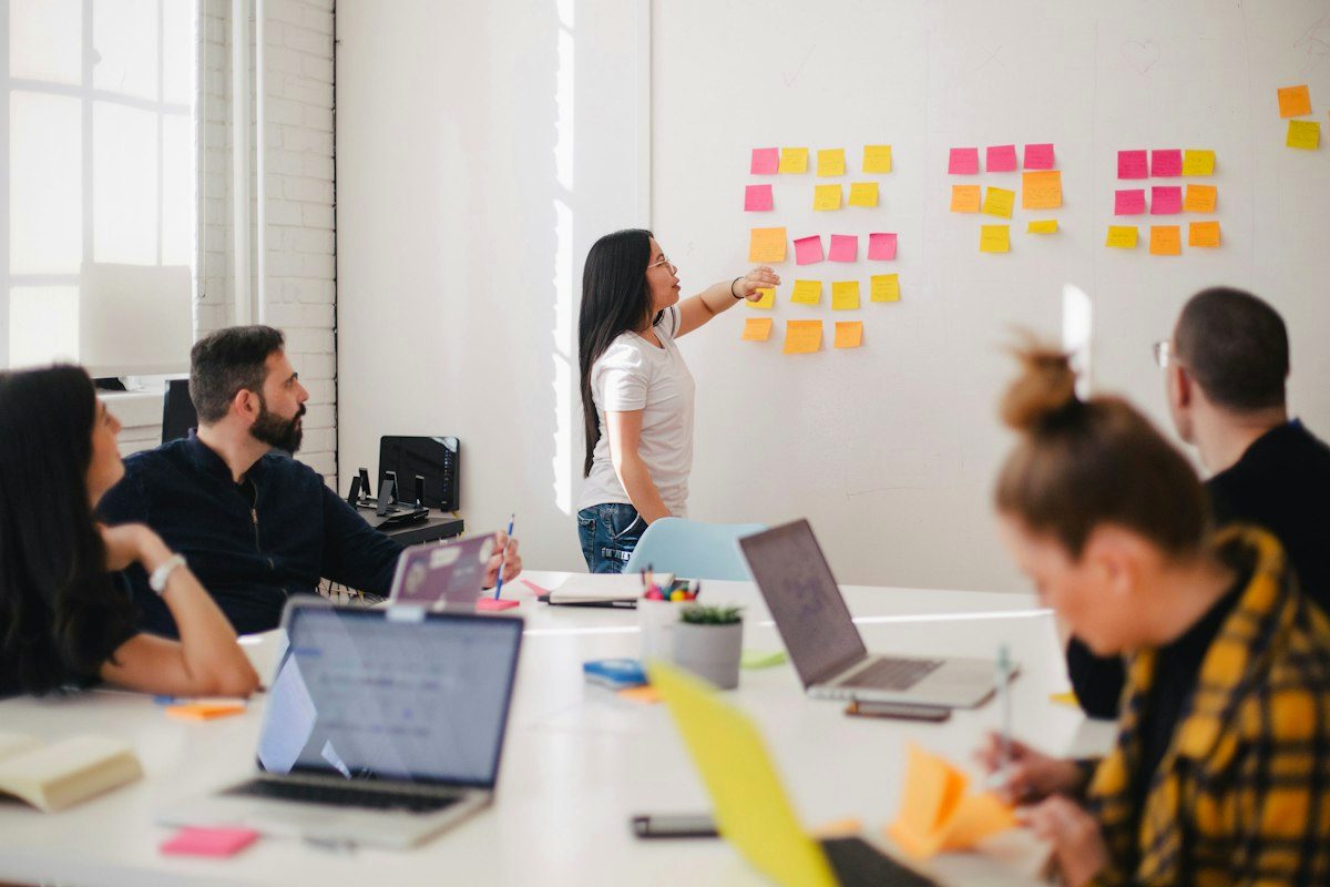 Team storyboarding a presentation with sticky notes